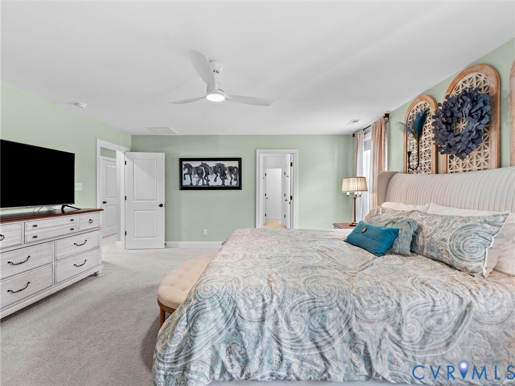 16106 Cambian Lane Chesterfield, VA 23832 - Photo 31 of 50 a spacious bedroom with a bed and a flat screen tv