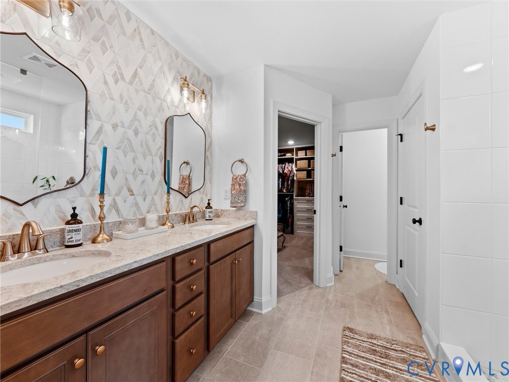 16106 Cambian Lane Chesterfield, VA 23832 - Photo 32 of 50 a spacious bathroom with a double vanity sink double and mirror