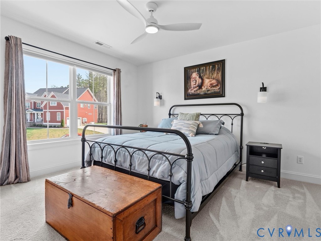 16106 Cambian Lane Chesterfield, VA 23832 - Photo 36 of 50 a bedroom with a bed and a painting on the wall