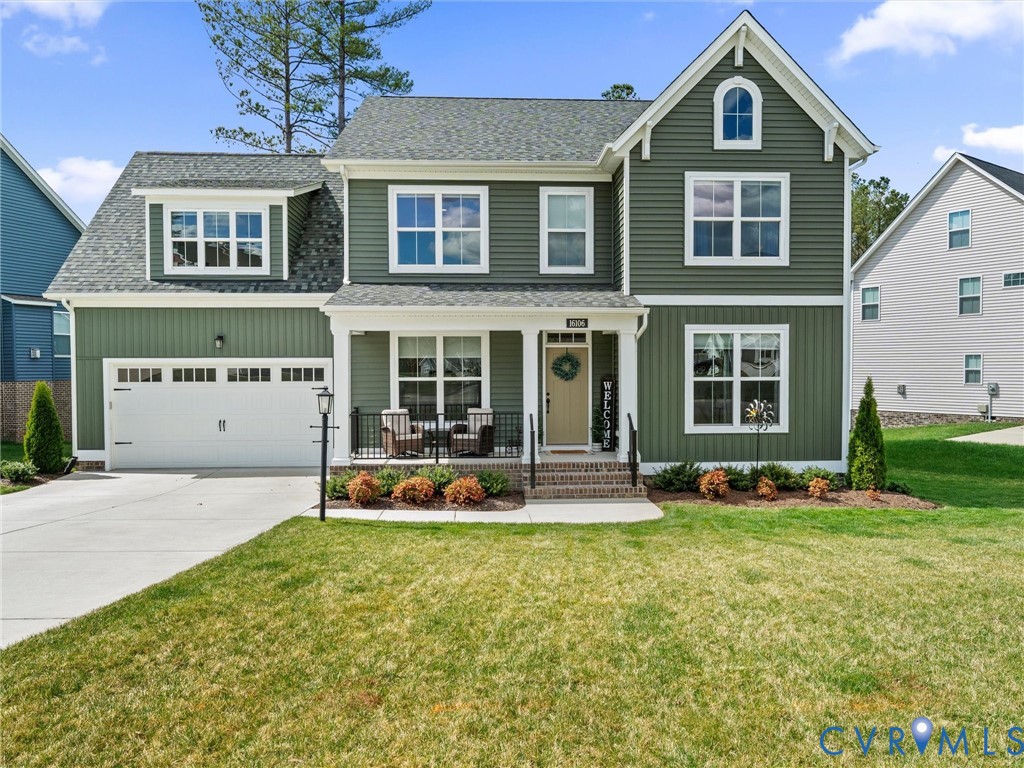 16106 Cambian Lane Chesterfield, VA 23832 - Photo 8 of 50 a front view of a house with a yard table and chairs