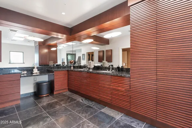 a kitchen with stainless steel appliances granite countertop a sink and cabinets