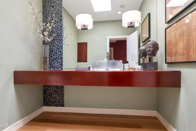 a bathroom with a sink and a mirror