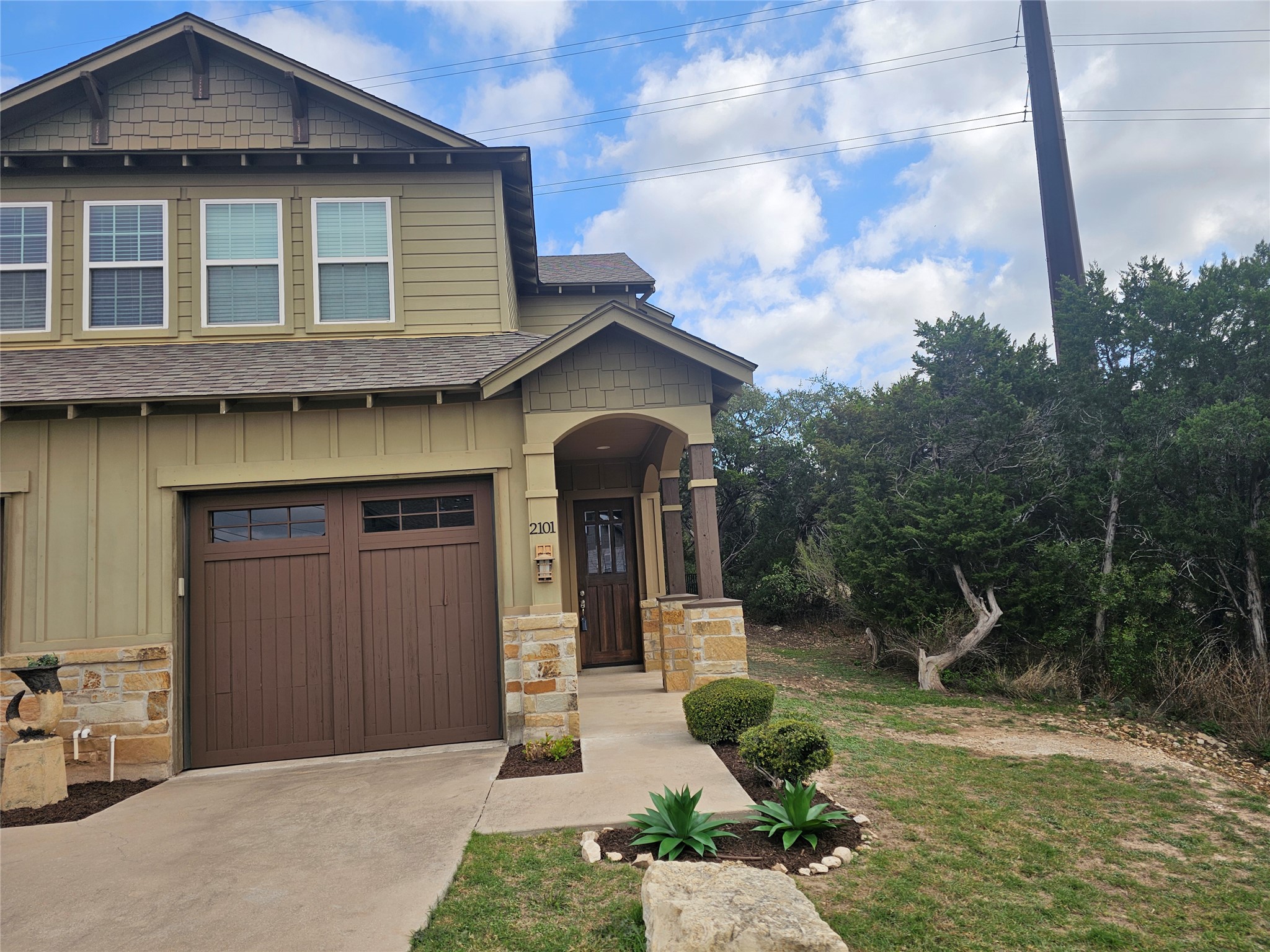 4301 Mansfield Dam Road, Unit 2101 Austin, TX 78734 - Photo 38 of 40 a front view of a house with garden