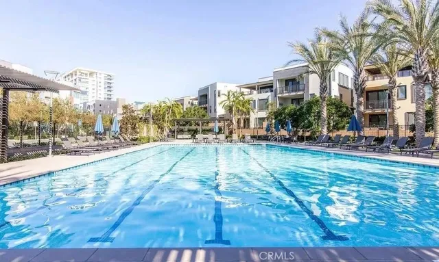 a view of a swimming pool with outdoor seating