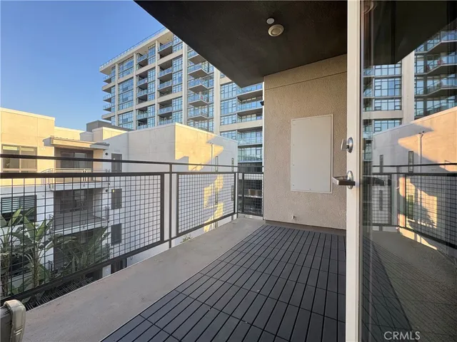 a view of a balcony with wooden floor