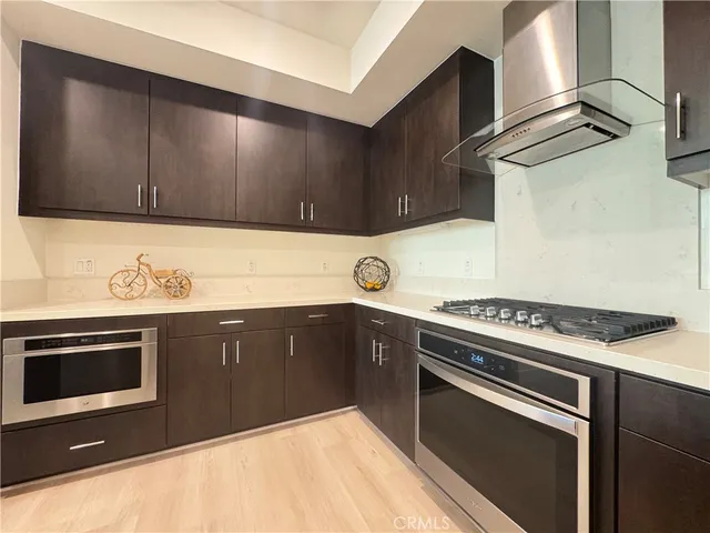 a kitchen with a stove and a sink