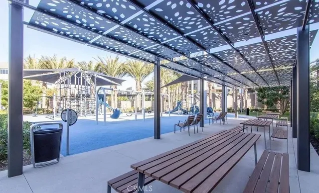 a view of a patio with lawn chairs floor to ceiling window with wooden floor