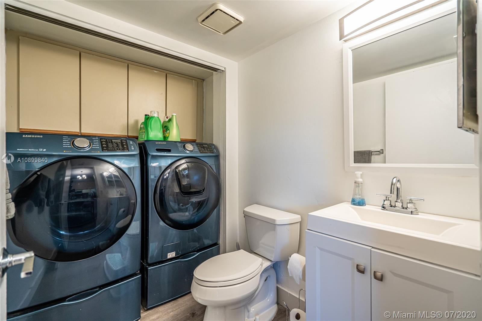 8447 Boca Rio Drive, Unit 8447 Boca Raton, FL 33433 - Photo 8 of 20 a bathroom with a toilet a sink and mirror