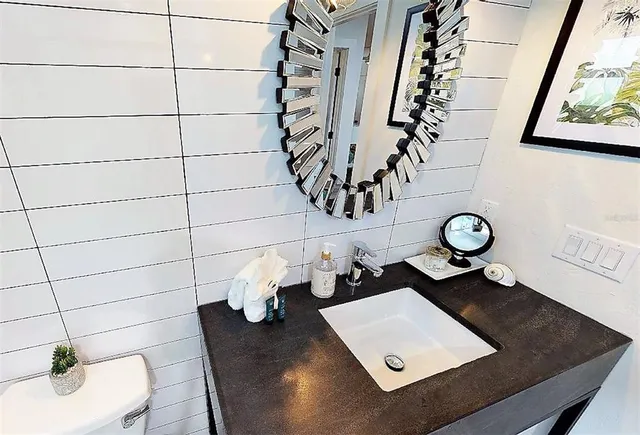 a bathroom with a sink and a mirror