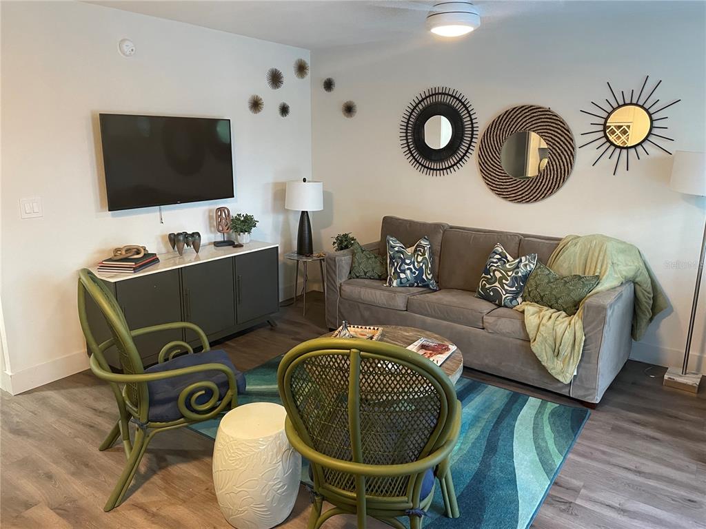 1912 Morrill Street, Unit LIME Sarasota, FL 34236 - Photo 4 of 34 a living room with furniture and a flat screen tv