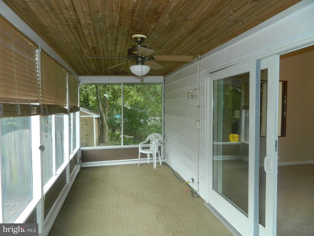 1252 Beach Road Edgewater, MD 21037 - Photo 13 of 20 In-closed porch area.