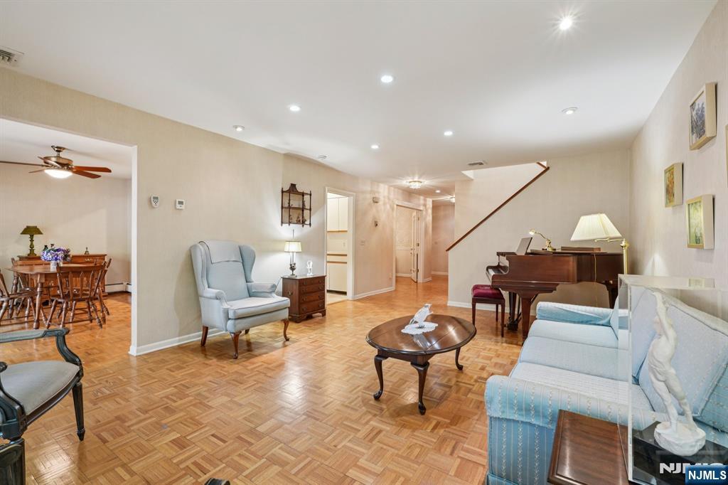 29 Ponds Circle, Unit 15 Wayne, NJ 07470 - Photo 12 of 47 a living room with furniture and a table