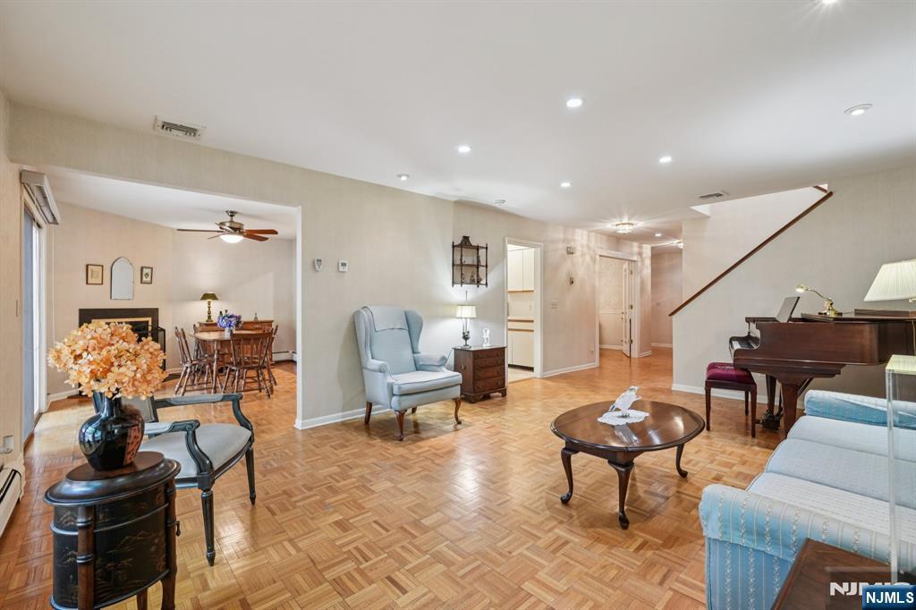 29 Ponds Circle, Unit 15 Wayne, NJ 07470 - Photo 13 of 47 a living room with furniture and wooden floor