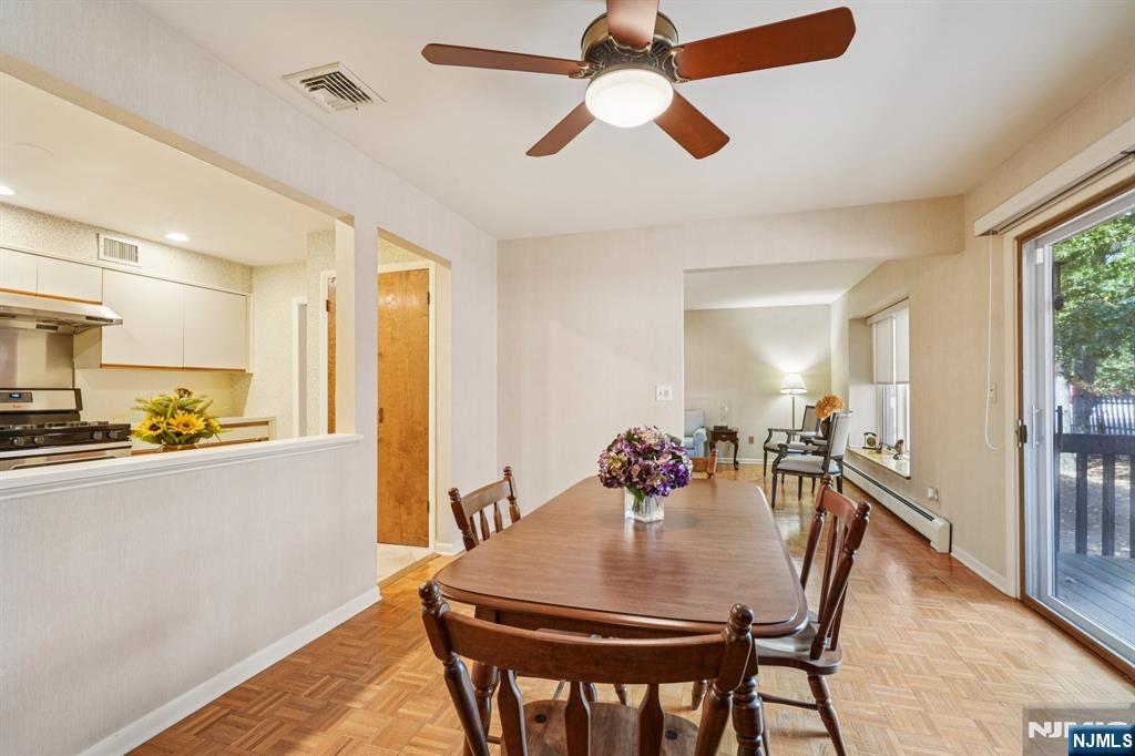 29 Ponds Circle, Unit 15 Wayne, NJ 07470 - Photo 19 of 47 a view of a dining room with furniture and a chandelier