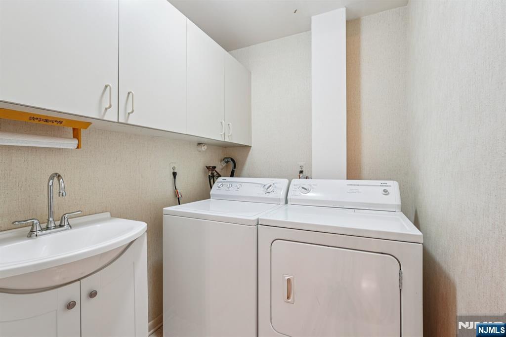 29 Ponds Circle, Unit 15 Wayne, NJ 07470 - Photo 25 of 47 a utility room with dryer and washer