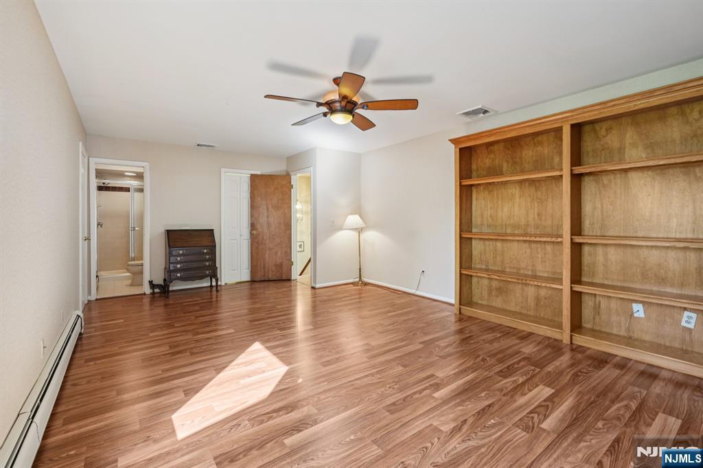 29 Ponds Circle, Unit 15 Wayne, NJ 07470 - Photo 27 of 47 a view of a livingroom with wooden floor