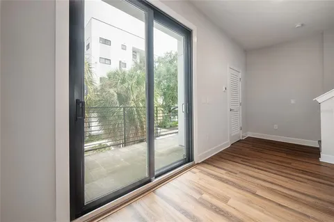 a view of an empty room and glass door