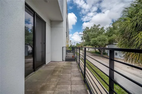 a view of balcony with wooden floor and bench