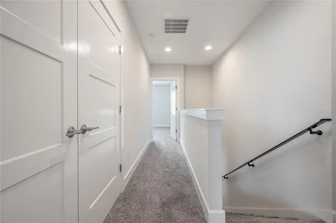 a view of a hallway with a shower