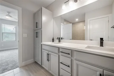 a bathroom with a sink and a mirror