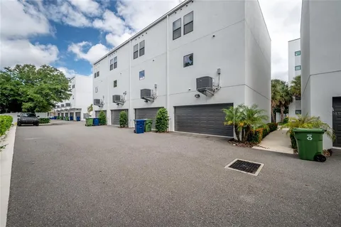 a view of a street with garage