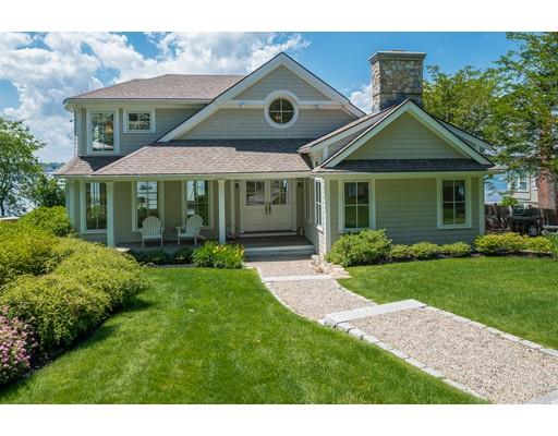 a front view of a house with a yard and porch
