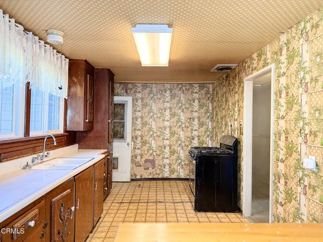 a bathroom with a double vanity sink toilet and shower