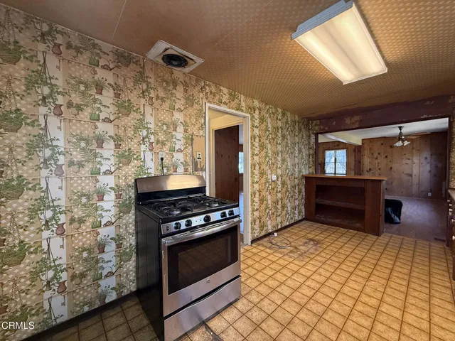 a view of a kitchen with a sink and a window