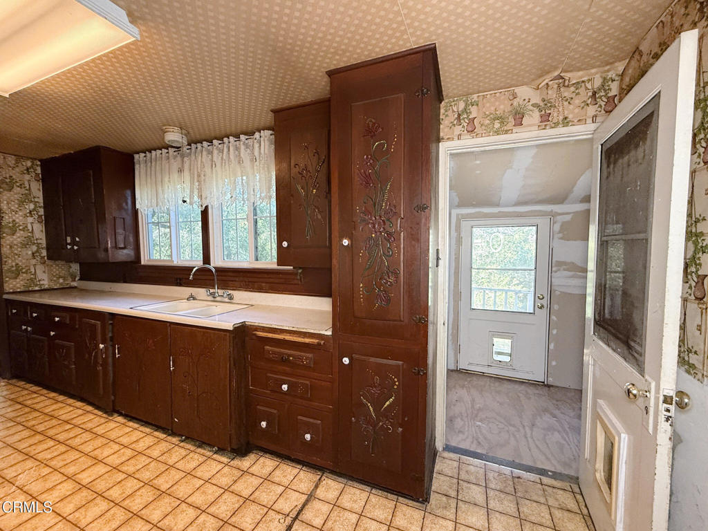561 Tico Road Ojai, CA 93023 - Photo 23 of 59 a spacious bathroom with a double vanity sink and a mirror