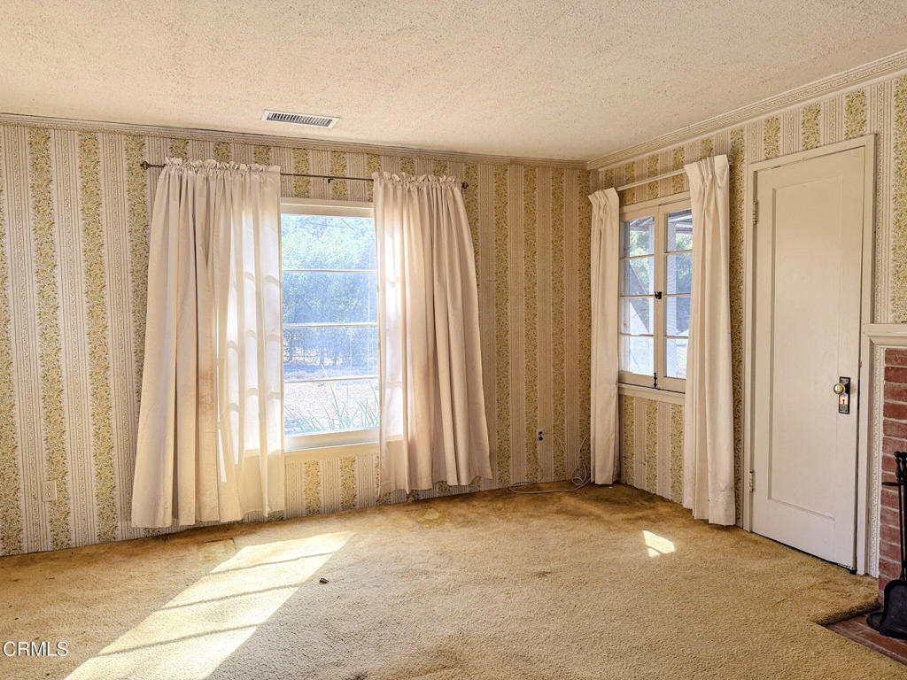 561 Tico Road Ojai, CA 93023 - Photo 26 of 59 a view of a room with a window and a curtain