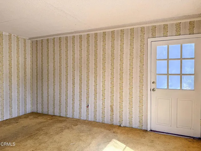 a view of a glass door and a window