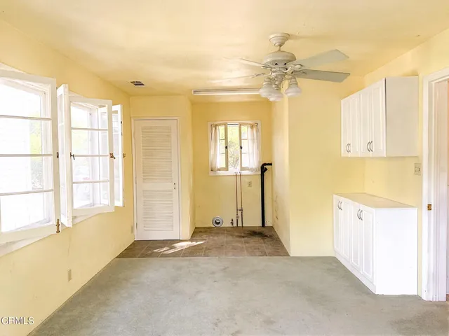 an empty room with windows