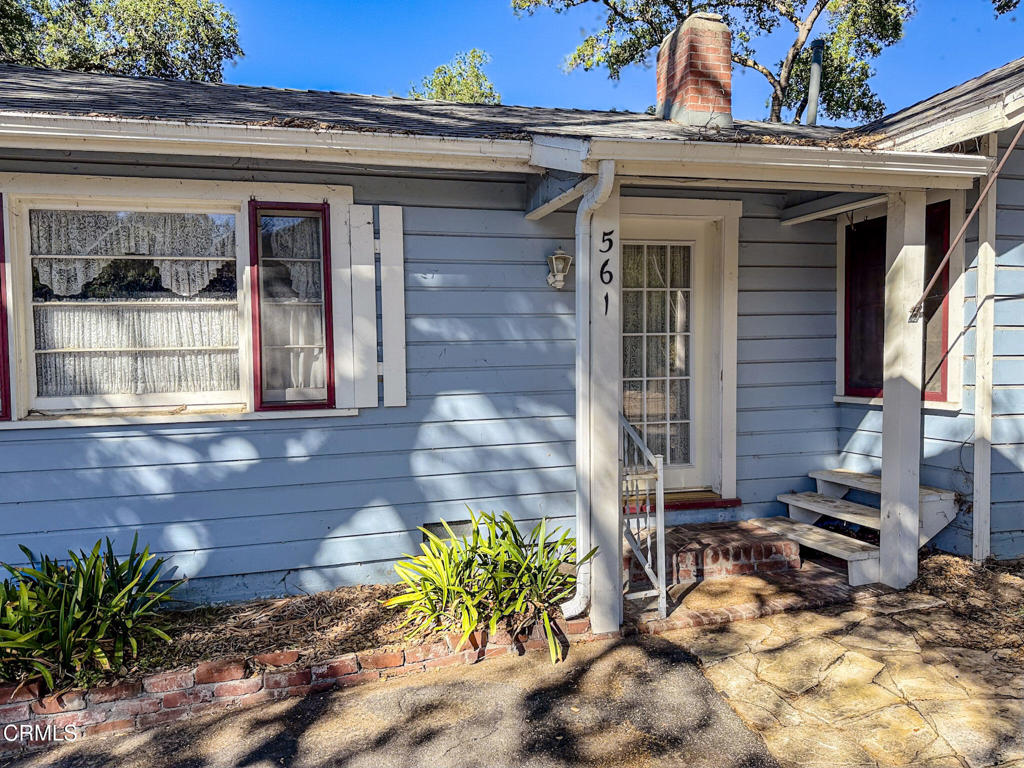 561 Tico Road Ojai, CA 93023 - Photo 4 of 59 a view of a brick house with potted plants
