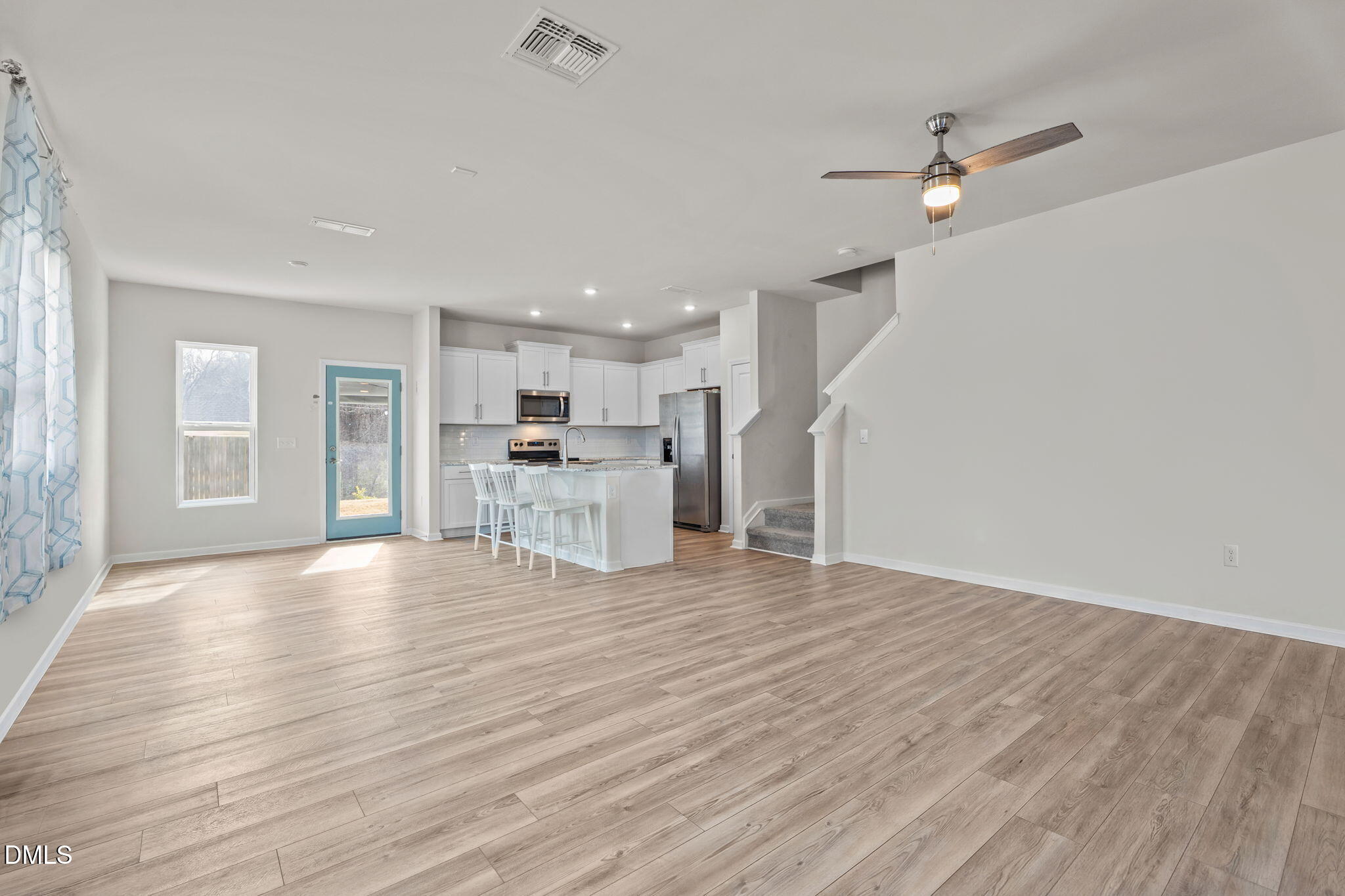 1572 Rhodes Pond Street Wendell, NC 27591 - Photo 9 of 44 a view of kitchen with wooden floor