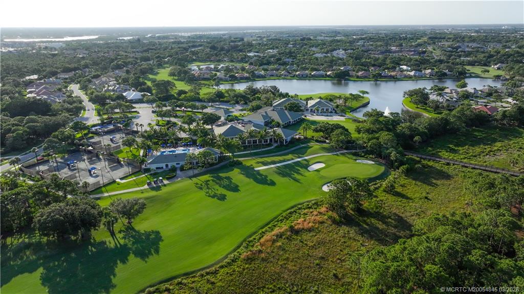 3510 Southeast Cambridge Drive Stuart, FL 34997 - Photo 38 of 38 18th hole at the Willoughby Golf Club with clubhouse, tennis courts, cabana and fitness center