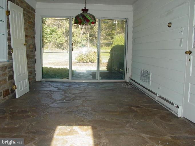 13414 Cambria Farms Road Phoenix, MD 21131 - Photo 13 of 25 breakfast room with stone flooring