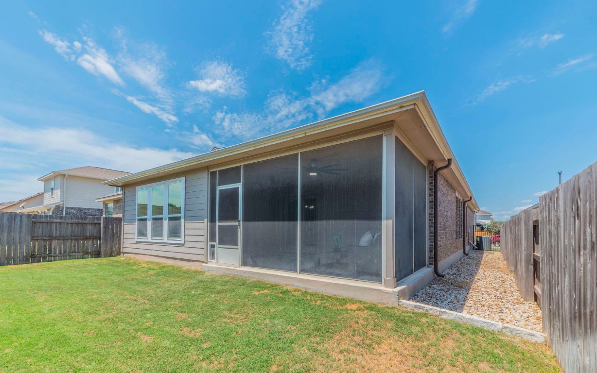 105 Penna Lane Georgetown, TX 78628 - Photo 29 of 39 a view of backyard with large trees and wooden fence