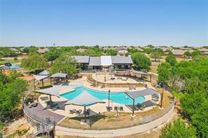 105 Penna Lane Georgetown, TX 78628 - Photo 33 of 39 a swimming pool with outdoor seating and green space