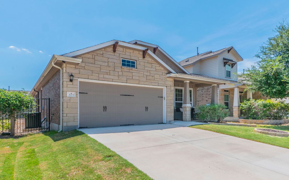 105 Penna Lane Georgetown, TX 78628 - Photo 4 of 39 a view of a house with a yard