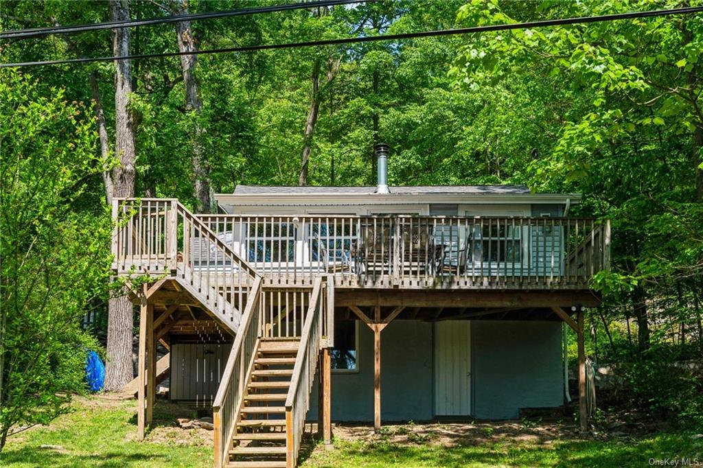 TWO homes included in this sale. Pictured here - beautifully renovated 156 Brook Tr. - 2 bedrooms, 1 bath, hardwood floors, amazing kitchen, woodburning stove, deck with views of the lake. Live here while you build 154. Or rent this as you build 154 Brook Tr.