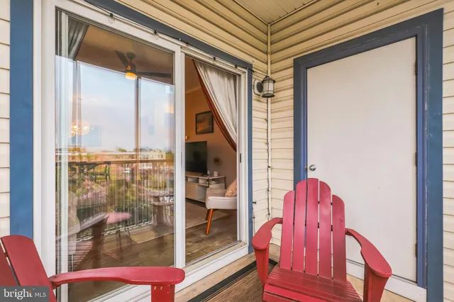 a view of a balcony with chairs