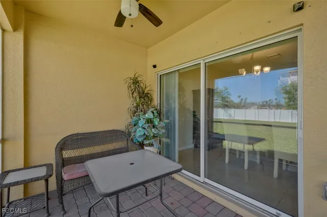 a room with furniture and a potted plant