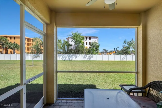 a view of a two chairs in the back yard