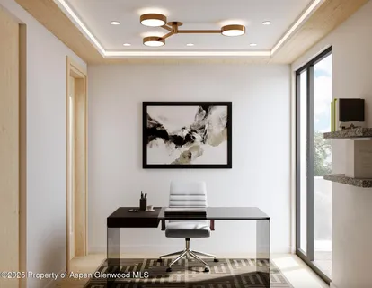 a view of a workspace with furniture and a flat screen tv