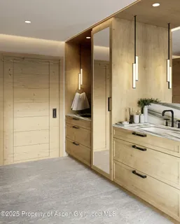 a bathroom with a shower sink and mirror