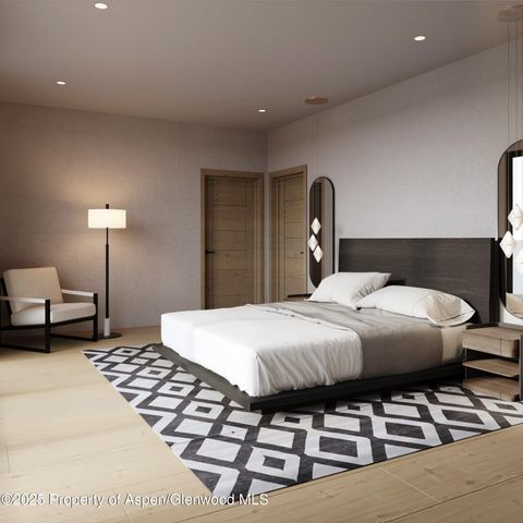 a bedroom with a bed and a lamp