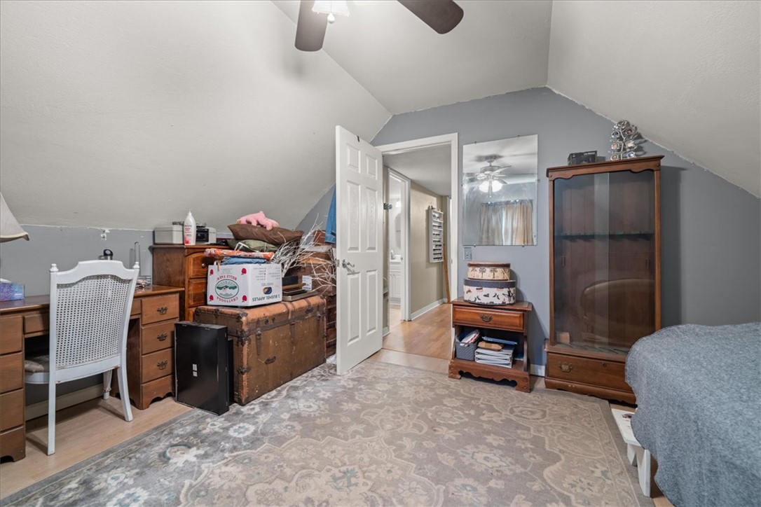 668 Marcengill Road Westminster, SC 29693 - Photo 33 of 37 Sloped ceilings and a ceiling fan enhance the spacious feel of this versatile room.