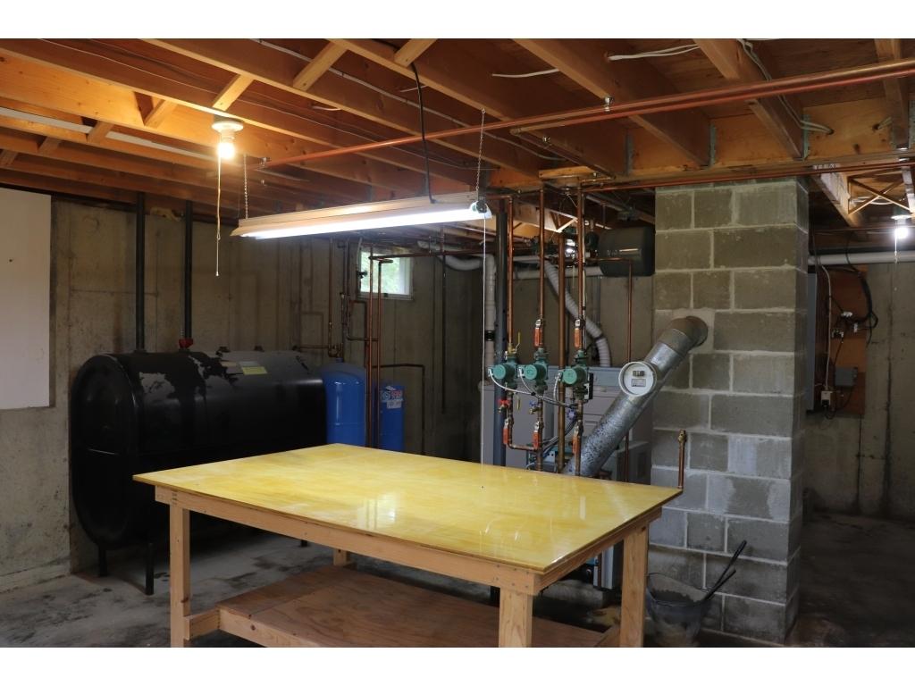 65 Pine Heath Road Bar Harbor, ME 04609 - Photo 24 of 31 24-full basement with walkout to back ya