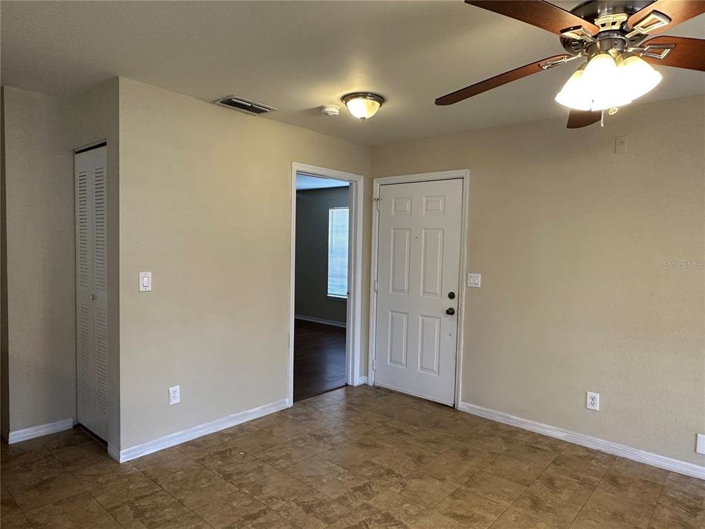 1065 South Hiawassee Road, Unit 1417 Orlando, FL 32835 - Photo 6 of 13 a view of an empty room and chandelier fan