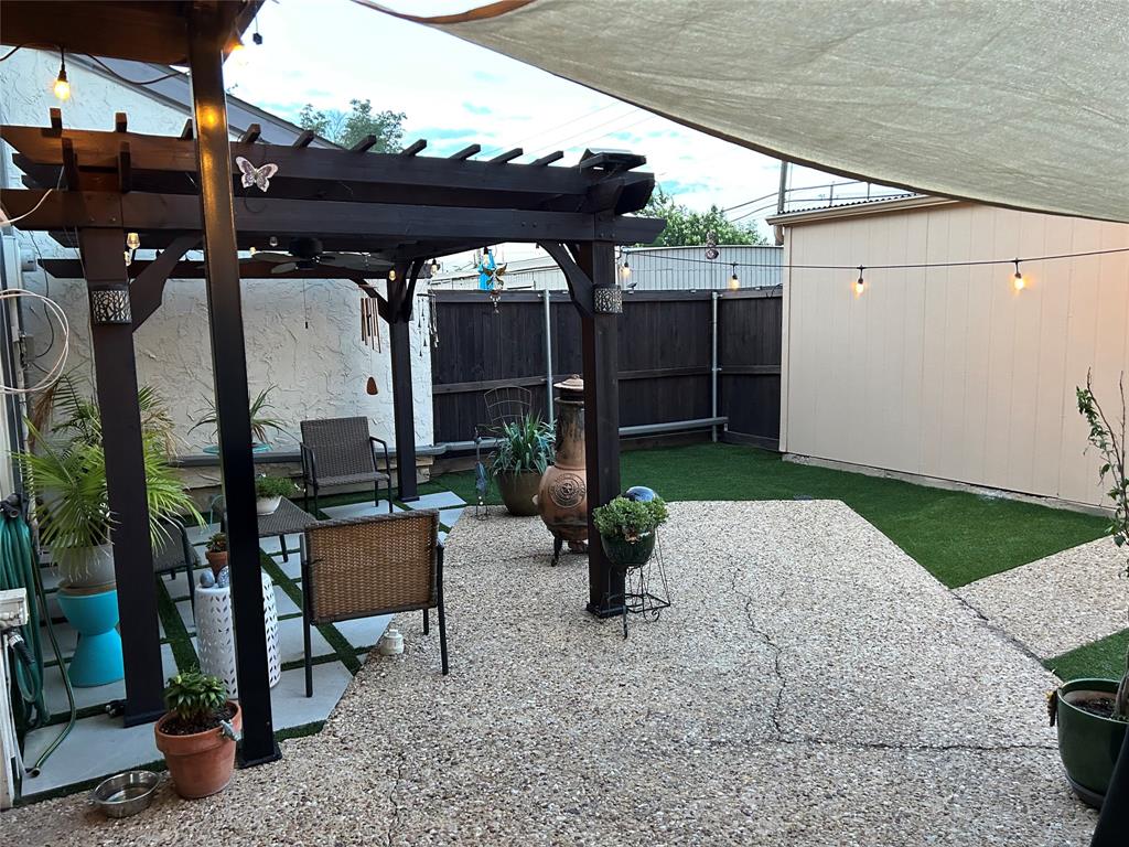 9446 Chimney Corner Dallas, TX 75243 - Photo 15 of 15 a backyard of a house with seating space